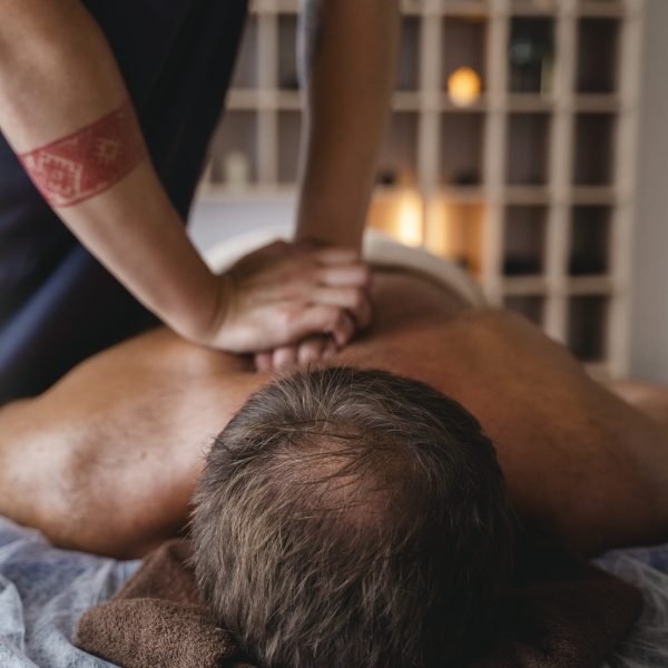 side-view-man-massaging-patient